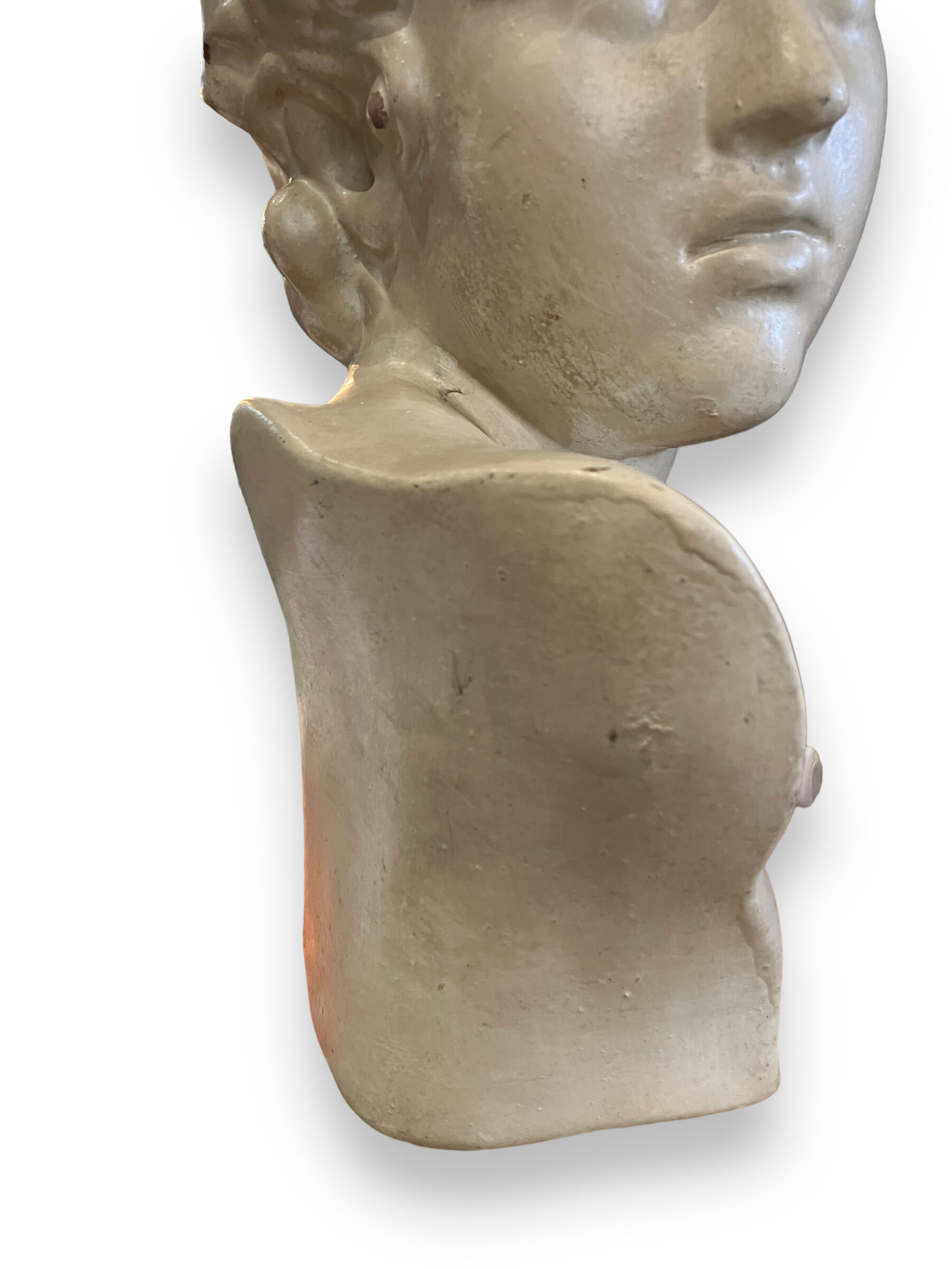 Bust of eros in glazed terracotta