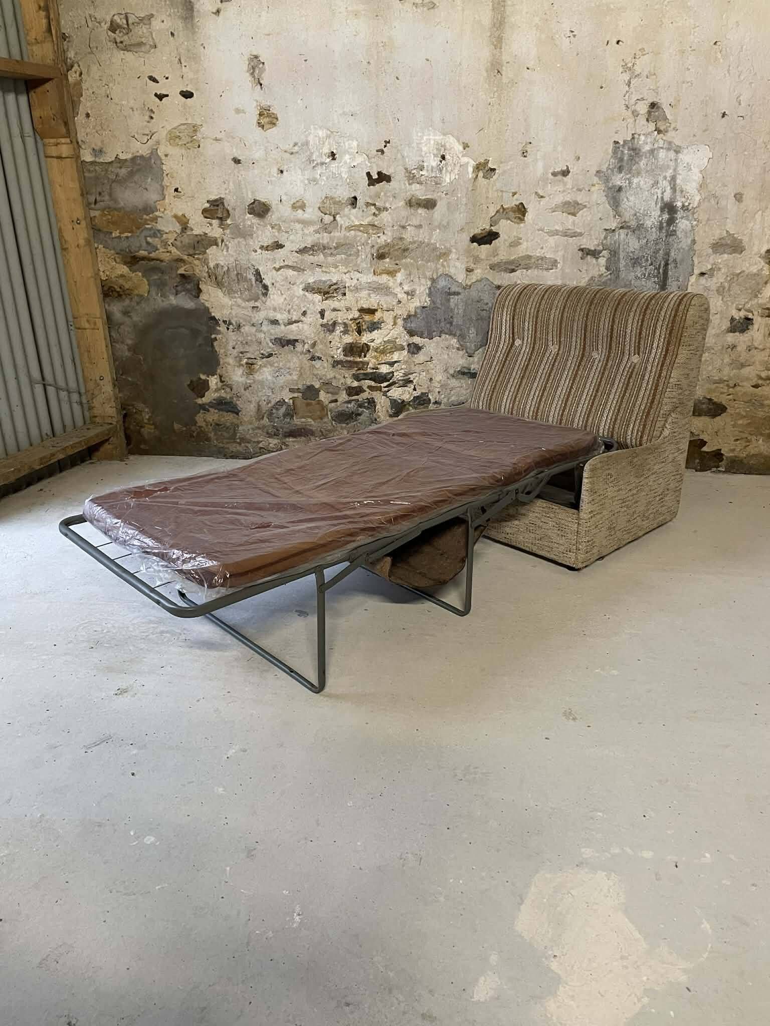 Vintage convertible armchair into a guest bed