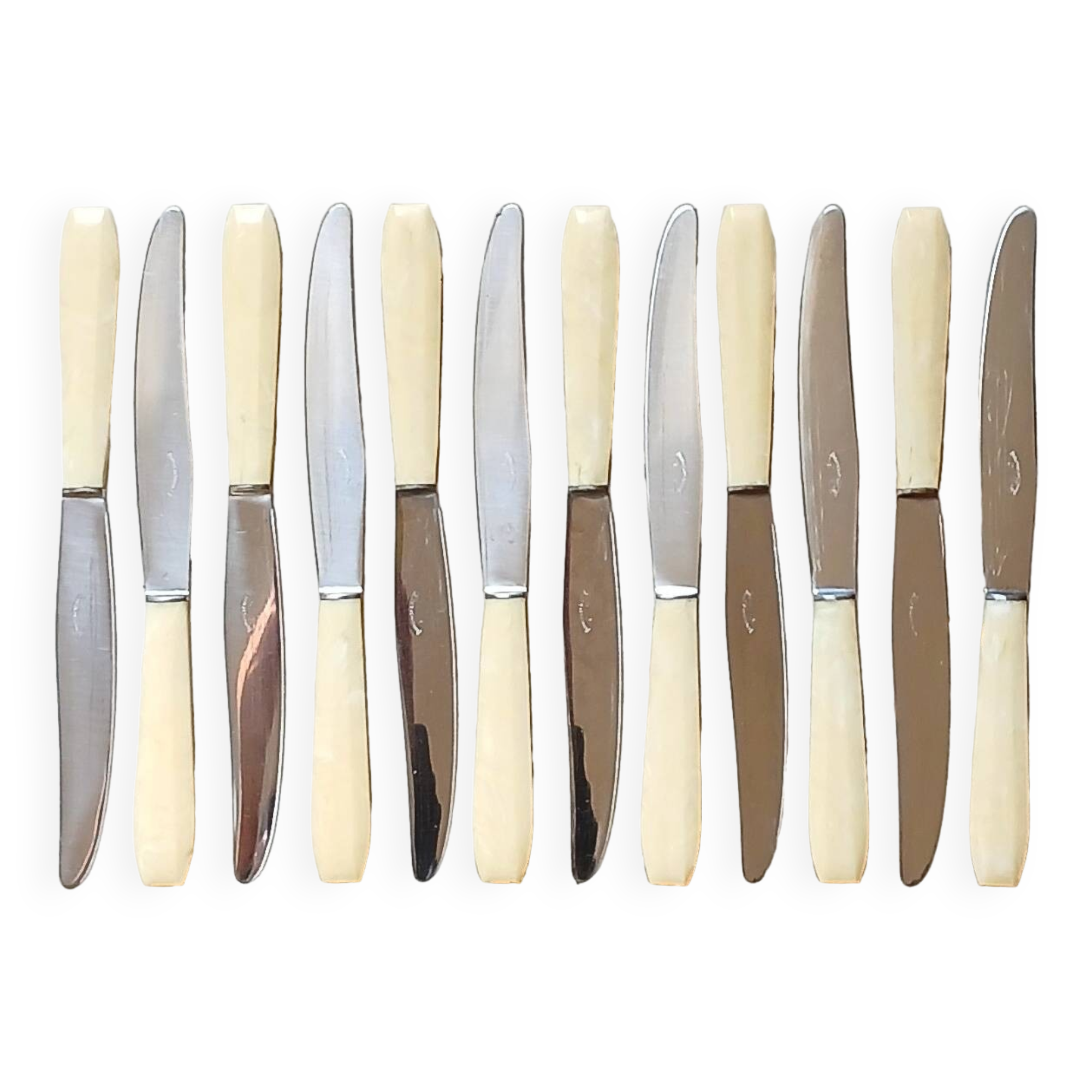 12 ivory & stainless steel bakelite knives in their case