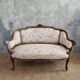 Small sofa or bench in Louis XV style, rococo.