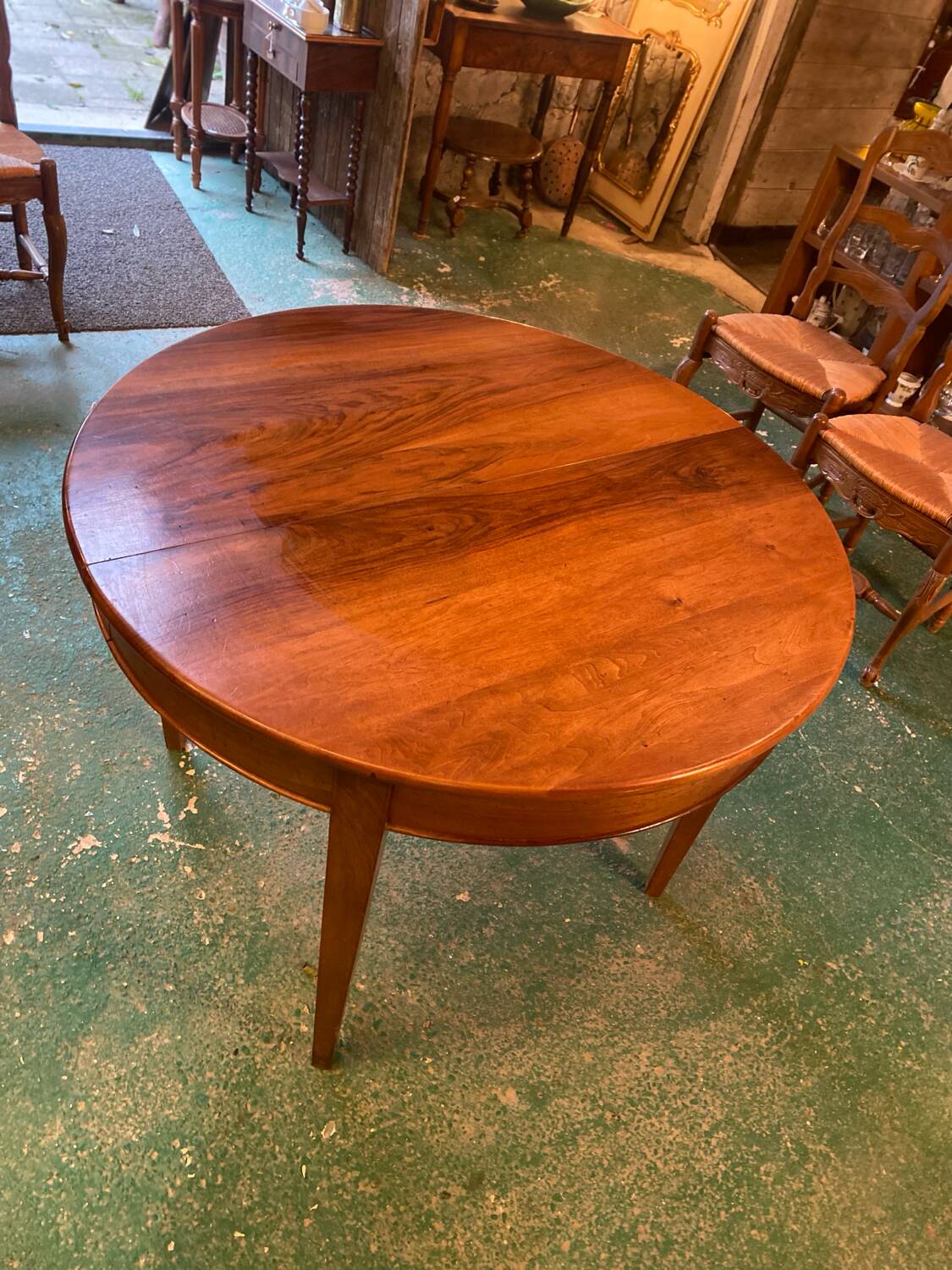 Louis XVI style oval walnut extendable table