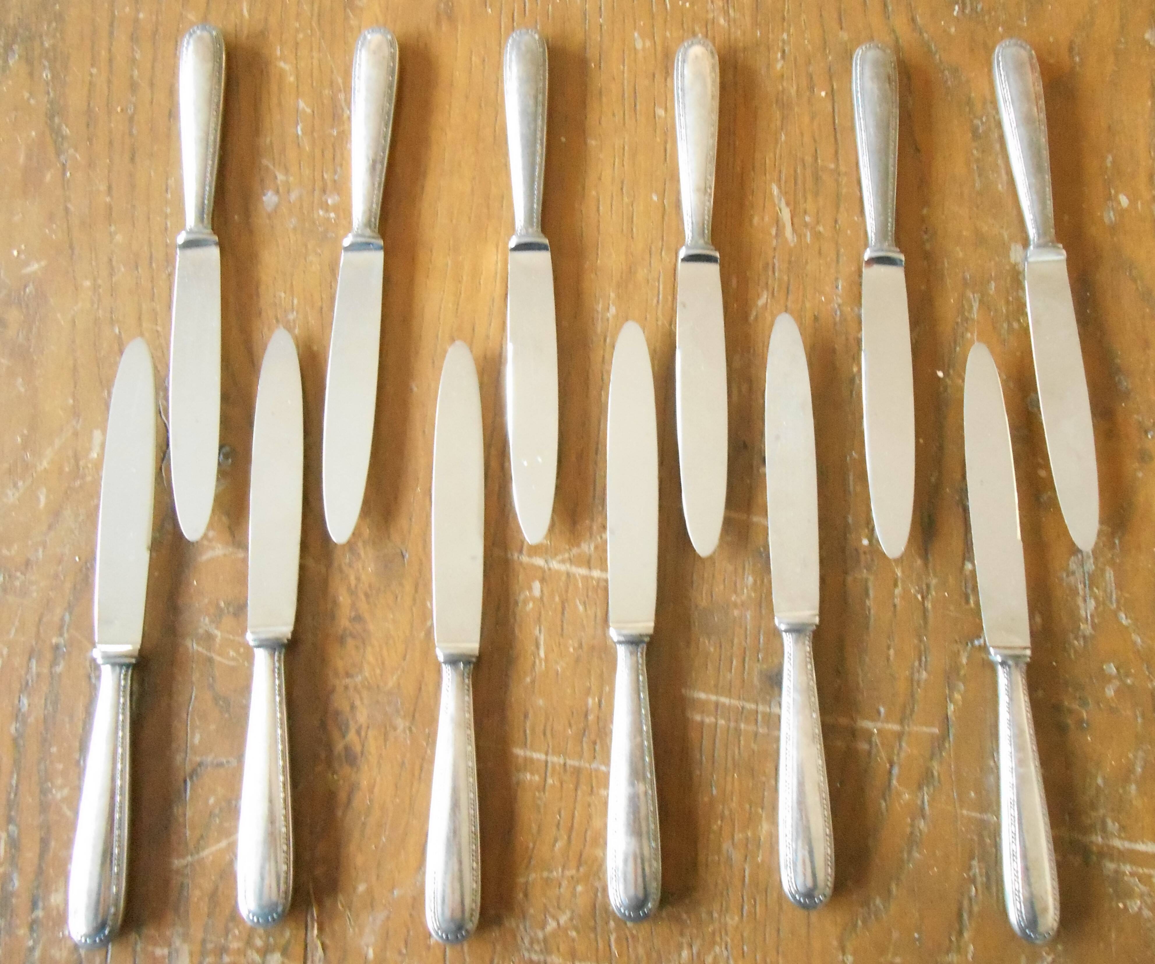 11 silver metal knives