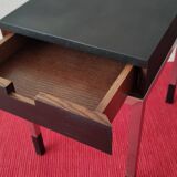 A pair of minimalist bedside tables