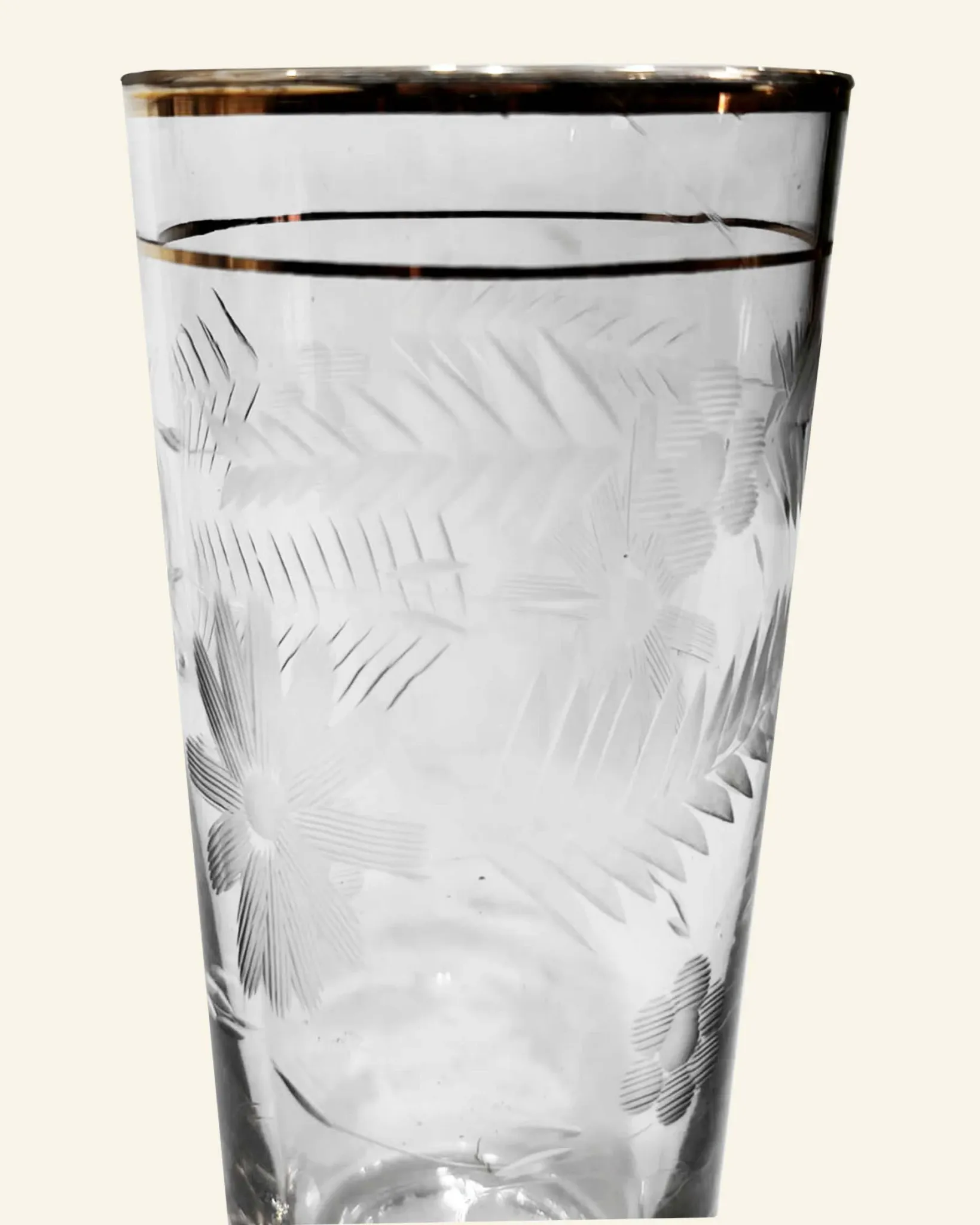 Four engraved crystal glasses from La Granja, with gilded edges, early 20th century.