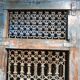 Openwork indian door in metal and blue wood
