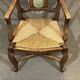 20th-century armchair in beech with a straw seat in Louis XV style.