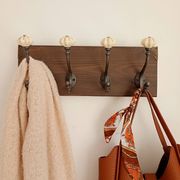 Wall-mounted coat rack wood hook cast iron and ceramic - handmade