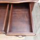 Louis XV style desk in wood, with a brown leather top.
