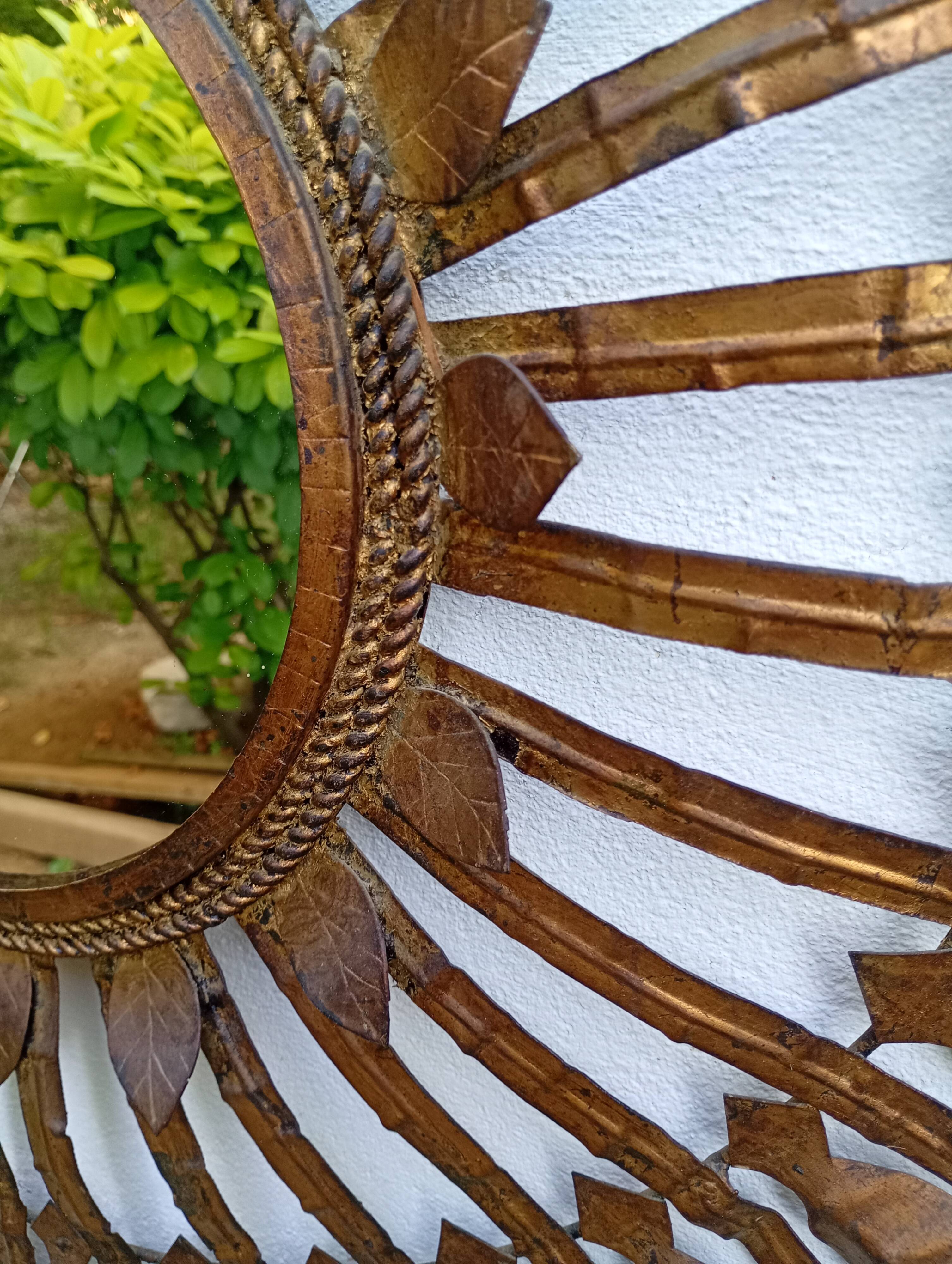 Vintage sun mirror in patinated gold metal – Spain 1950s / 60s