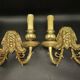 Pair of wall sconces with grotesque heads in 19th-century Renaissance style - bronze