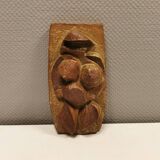 Ceramic relief portraying a lady. Emerging out of the background.