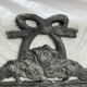 Patinated metal wall bracket and porcelain