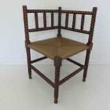 Corner chair in turned wood and straw