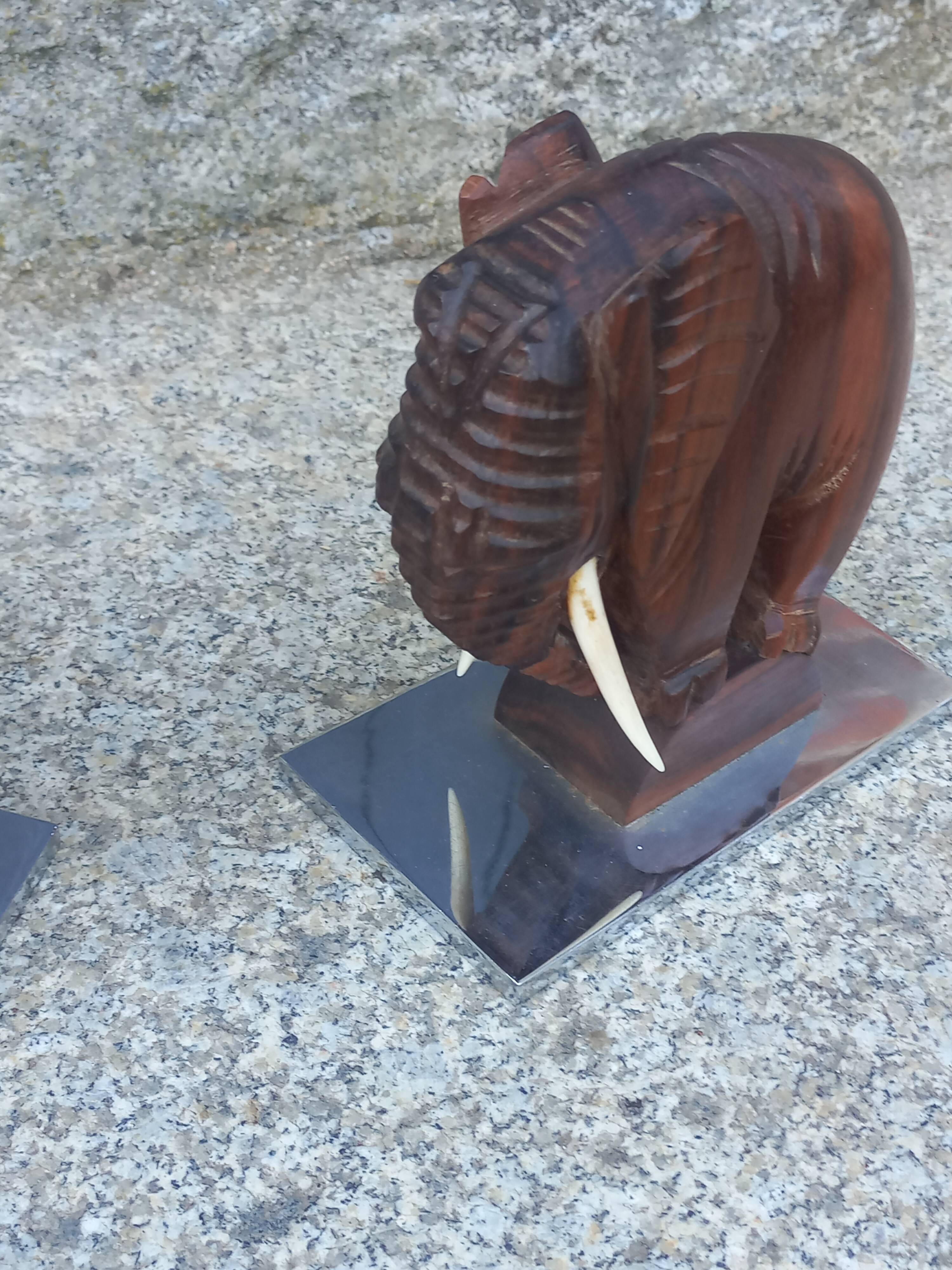 Pair of Art Deco elephant bookends in rosewood with chrome base.