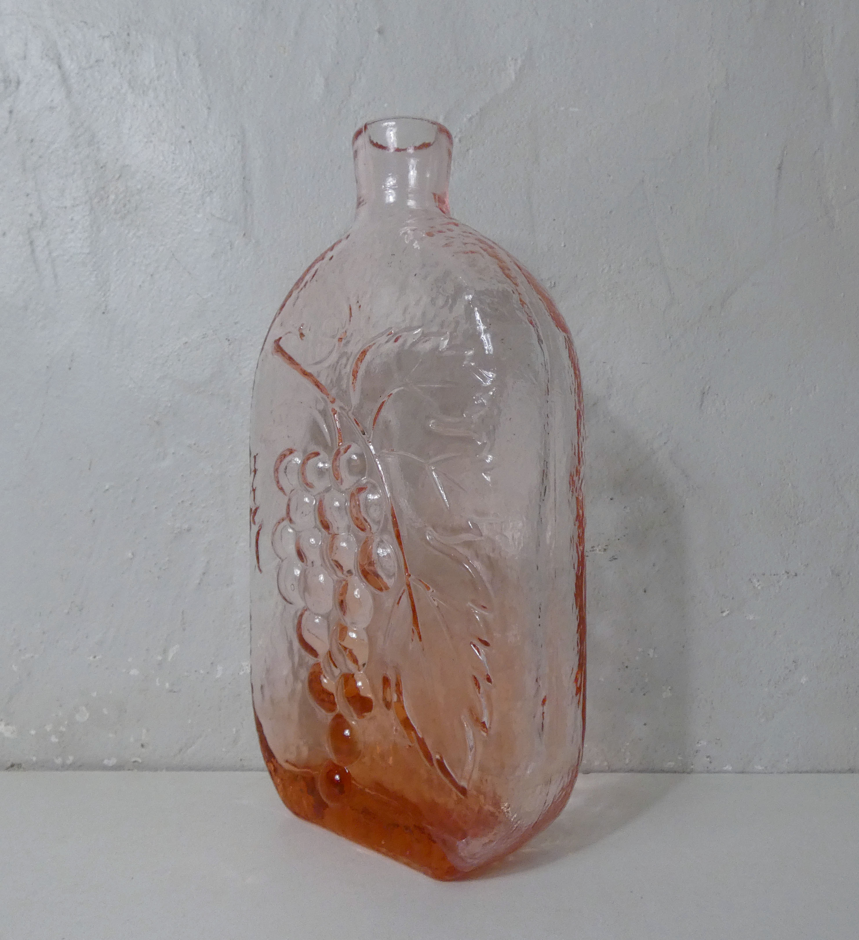 old carafe in orange pink glass