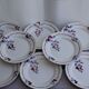 Set of 8 flat ceramic plates