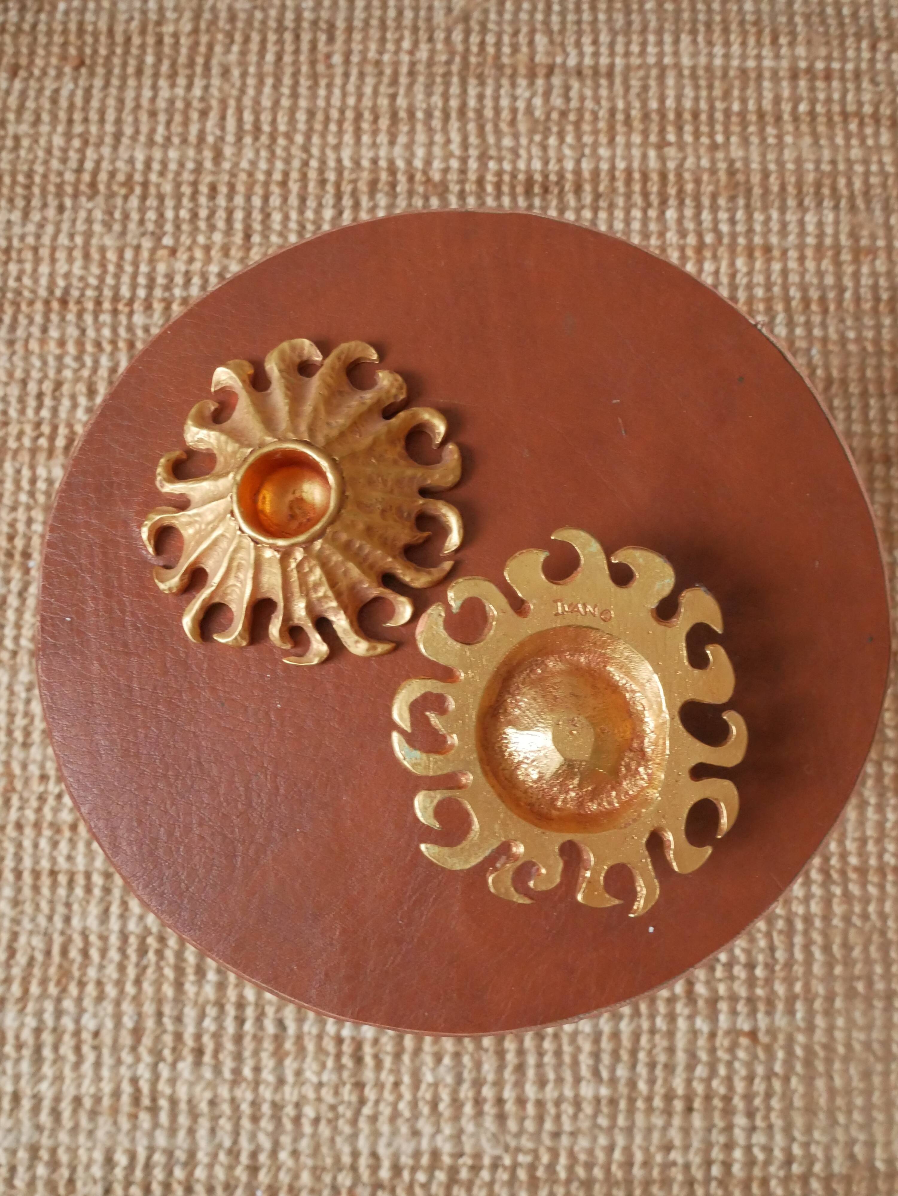 Pair of gold metal candle holders