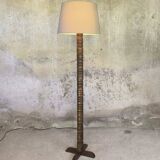 Vintage brutalist floor lamp made of turned wood.