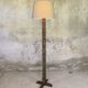 Vintage brutalist floor lamp made of turned wood.