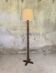 Vintage brutalist floor lamp made of turned wood.