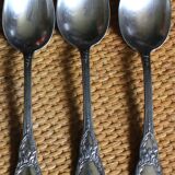 A set of 6 silver-plated metal soup spoons with foliage design.
