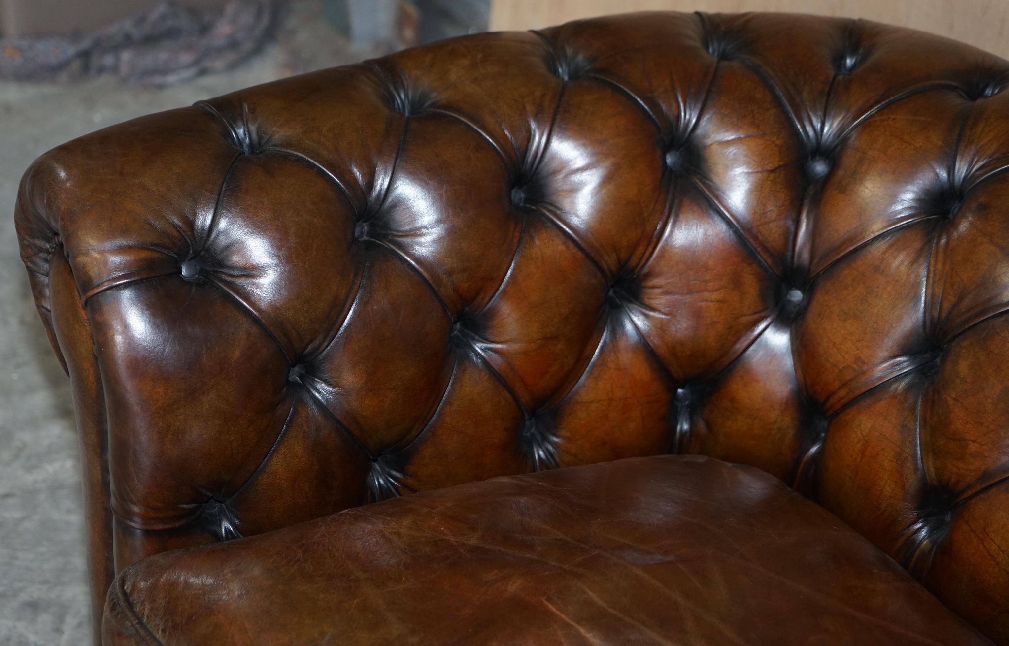 Restored leather Chesterfield sofa, walnut legs.