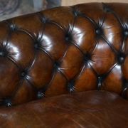 Restored leather Chesterfield sofa, walnut legs.