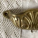 Old shell drawer handle in gilded brass