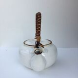 Vintage teapot with wicker handle
