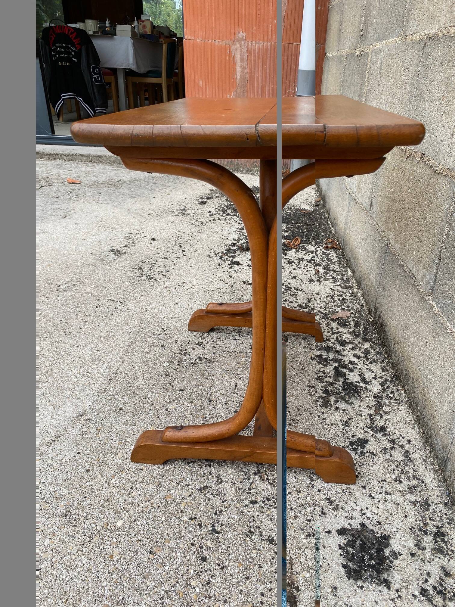Small side table or bistro serving table with curved wood.