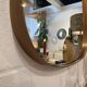Mirror, rear-view and free form in brass.