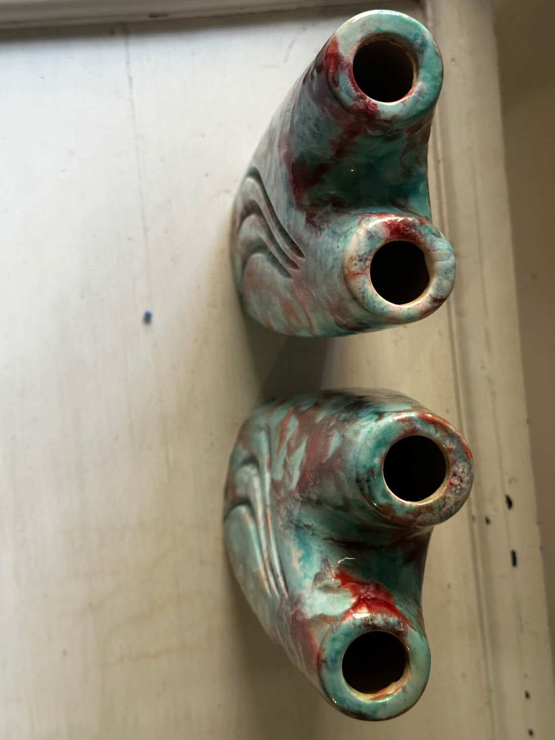 Vintage pair of turquoise and red ceramic candlesticks