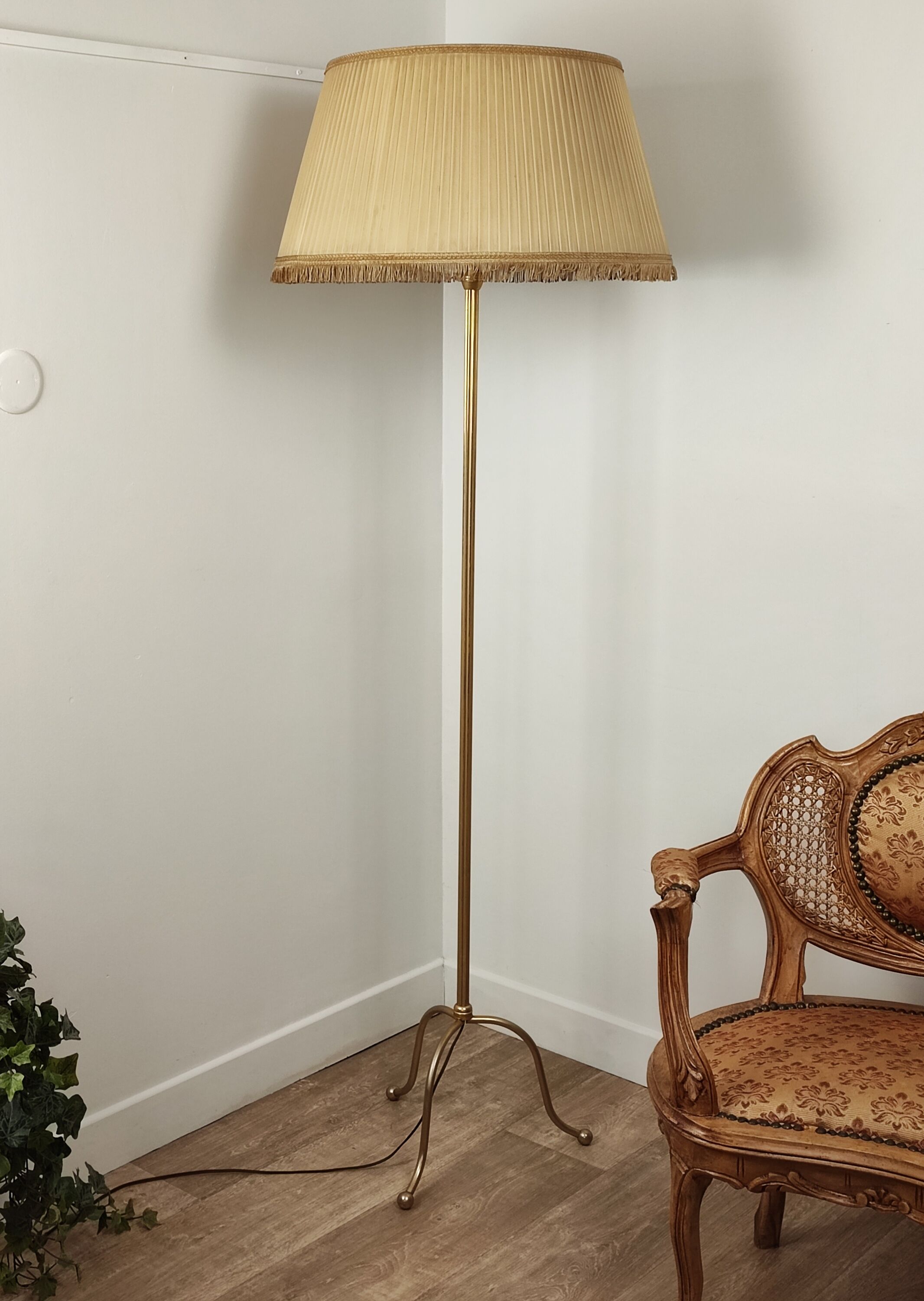 Golden tripod floor lamp