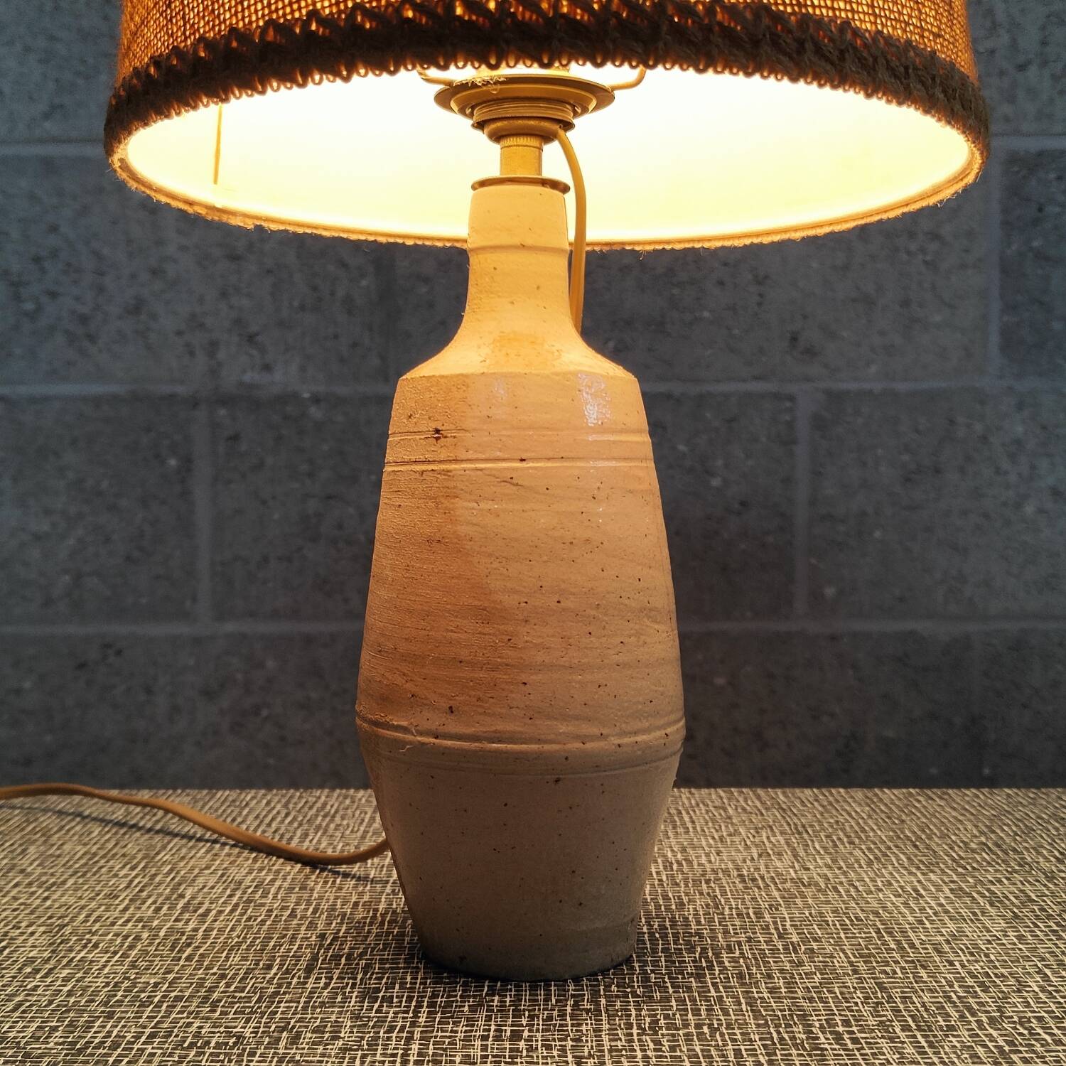 Patinated sandstone and jute ceramic lamp