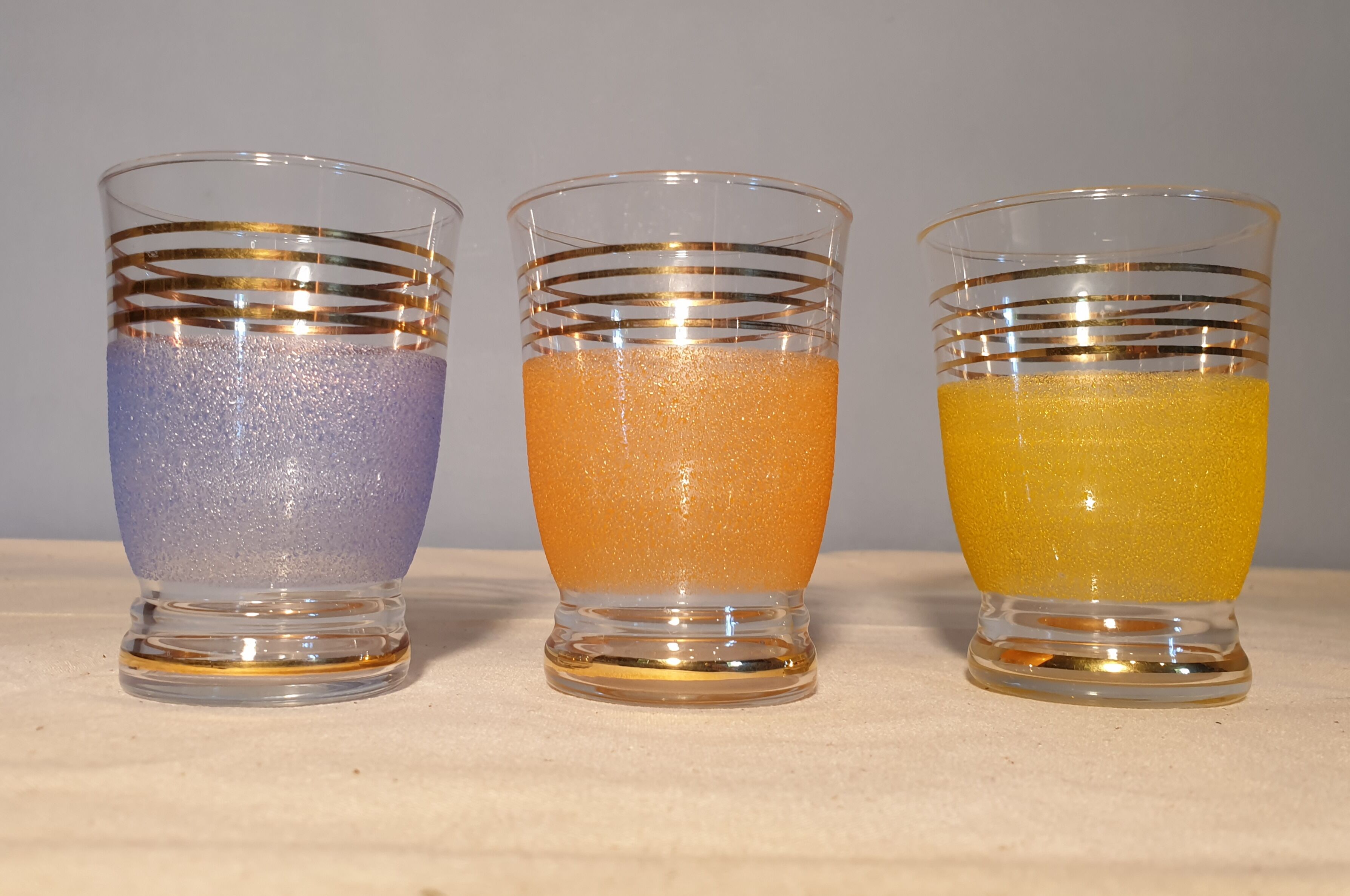 Three granite water glasses