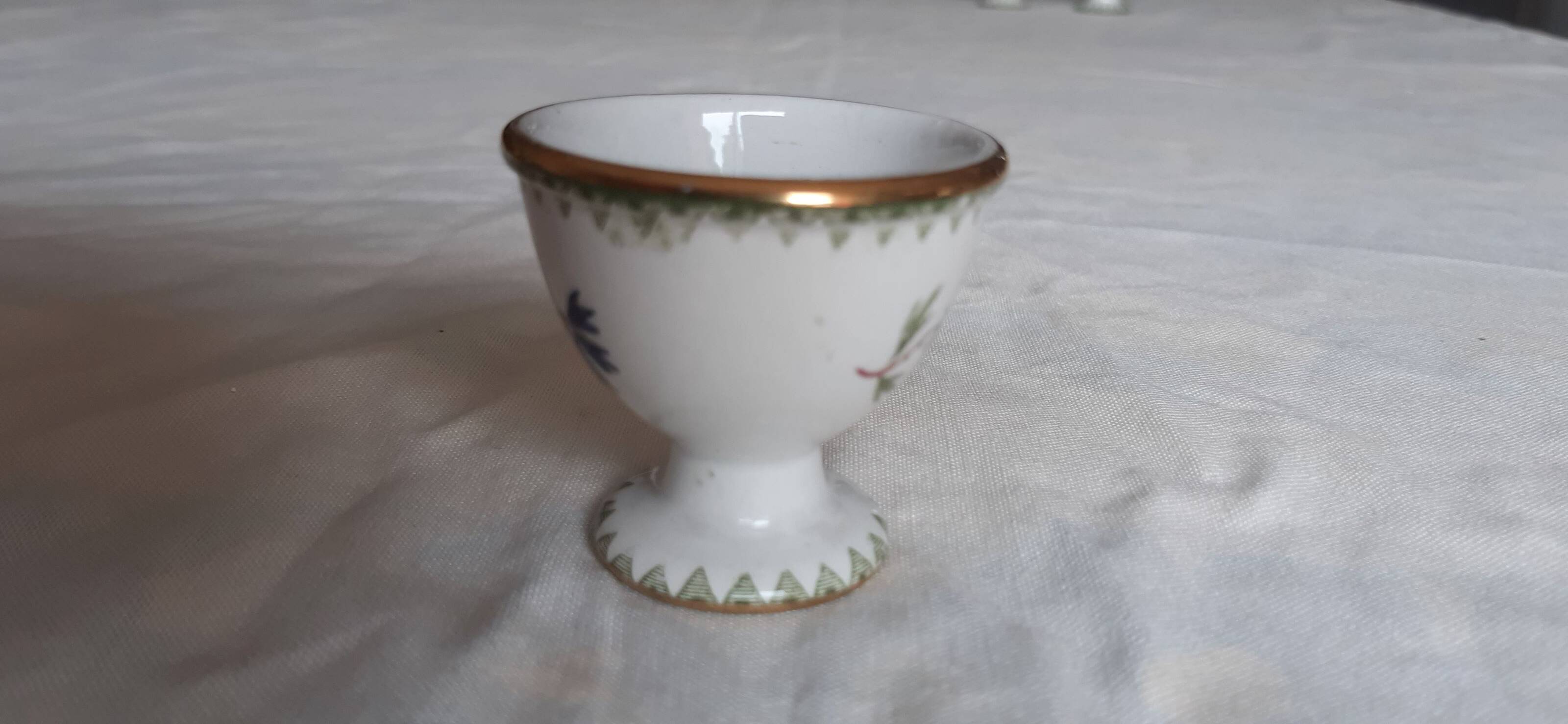 Set of three egg cups, barbel pattern decorations