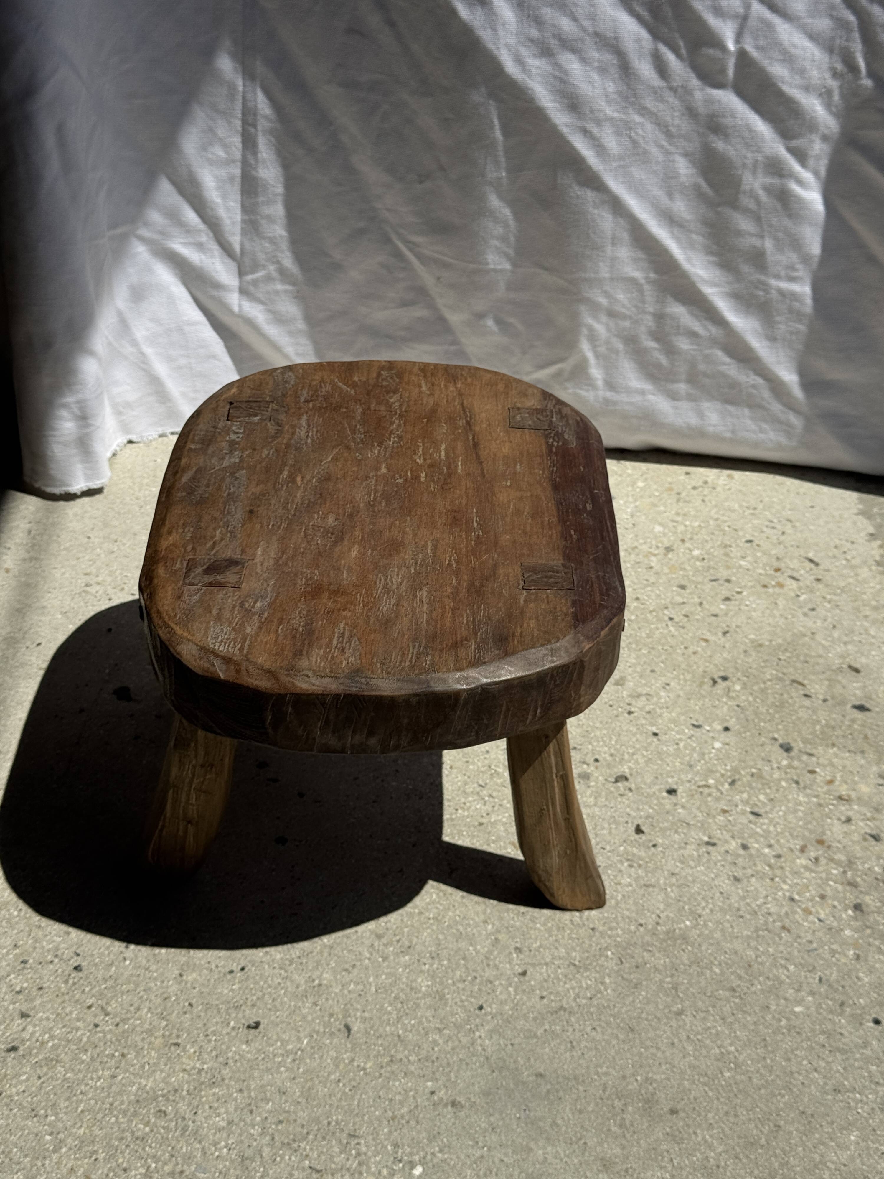Small stool, oval solid teak accent stool with a two-tone seat.