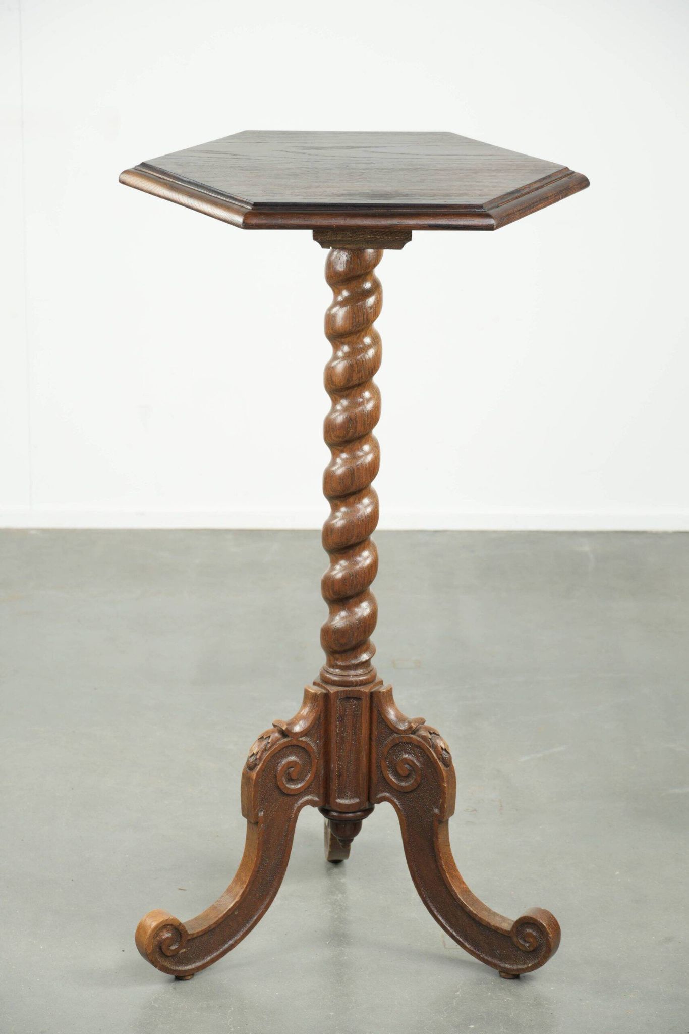 Antique tall oak plant/side table with wood carving and a turned leg