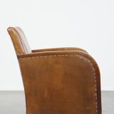 Cognac-colored sheepskin and wooden Art Deco design armchair