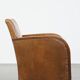 Cognac-colored sheepskin and wooden Art Deco design armchair