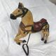 Wooden horse with period ironwork support
