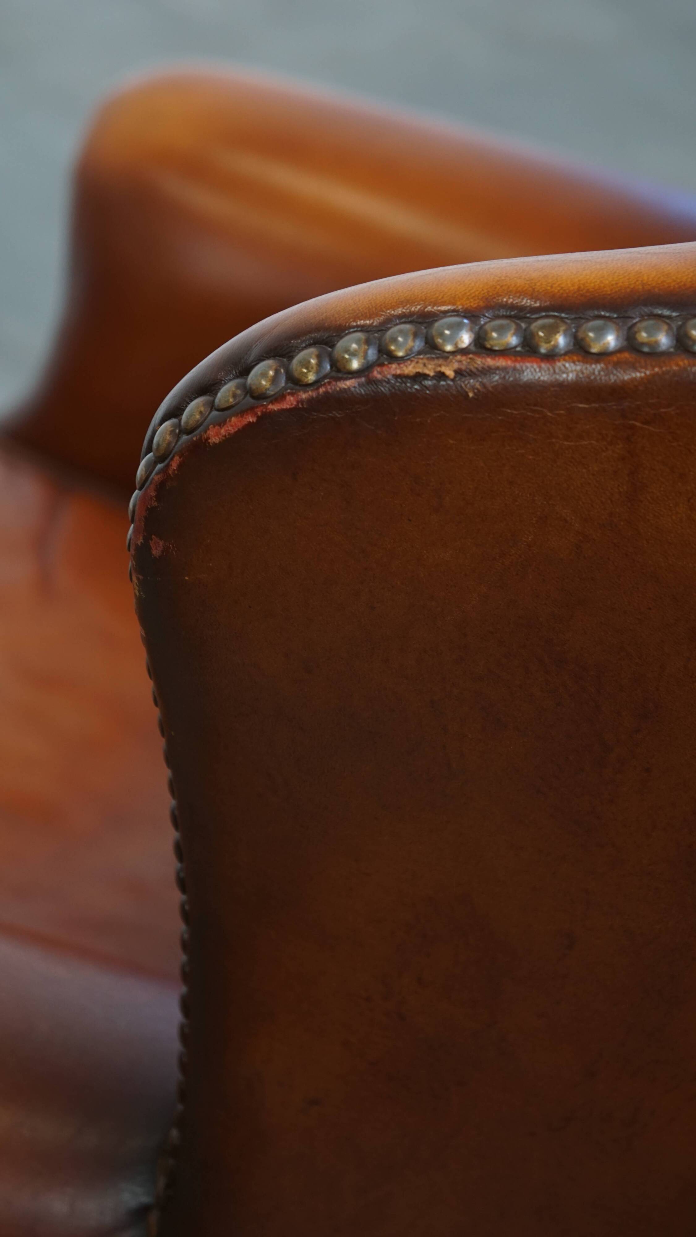 Fauteuil à oreilles en cuir de mouton