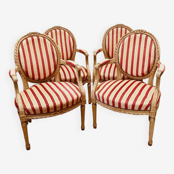 Suite of four Louis XVI style medallion armchairs in 20th century patinated wood