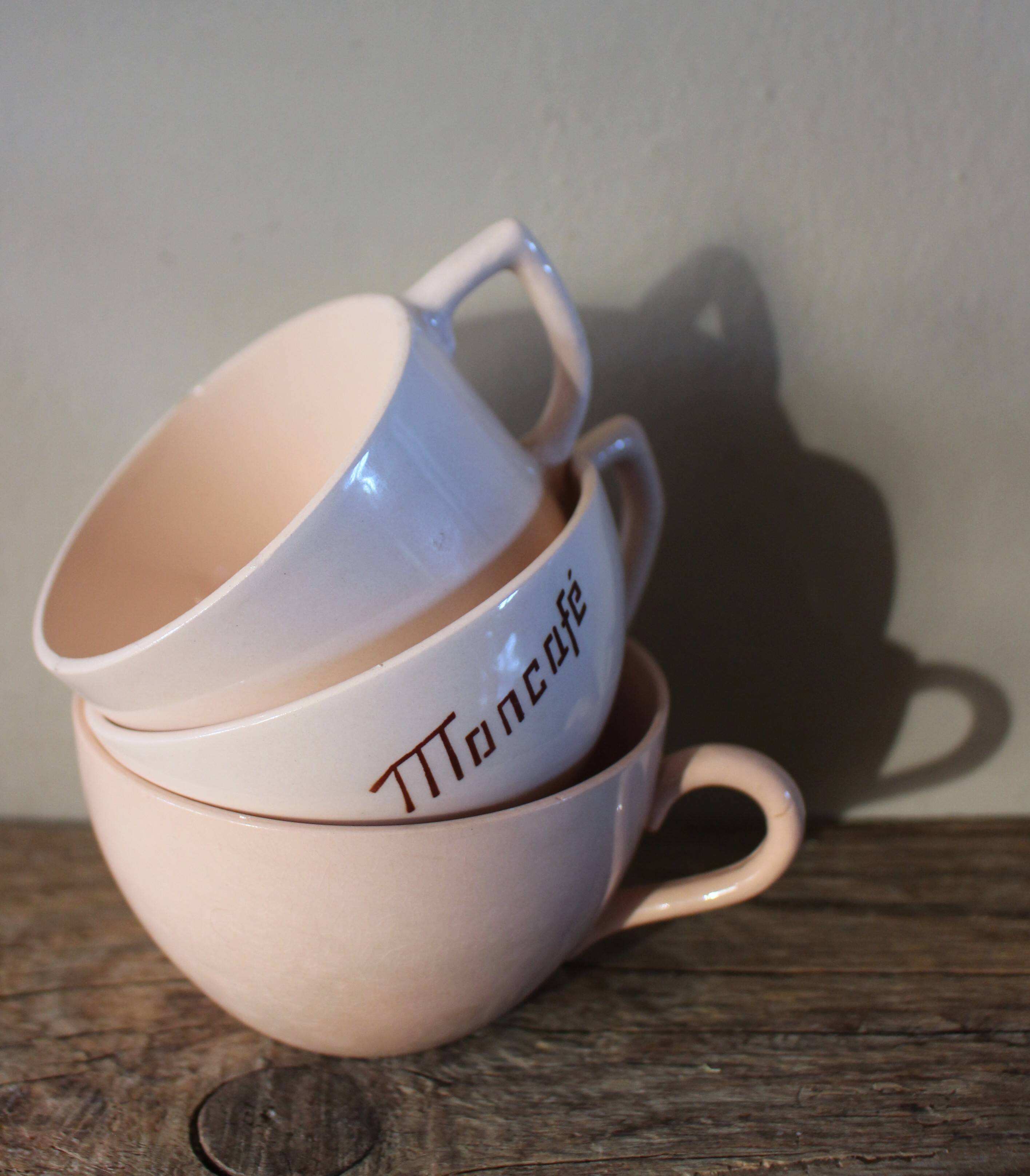 A set of 3 pink earthenware cups from Digoin Sarreguemines.