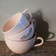 A set of 3 pink earthenware cups from Digoin Sarreguemines.