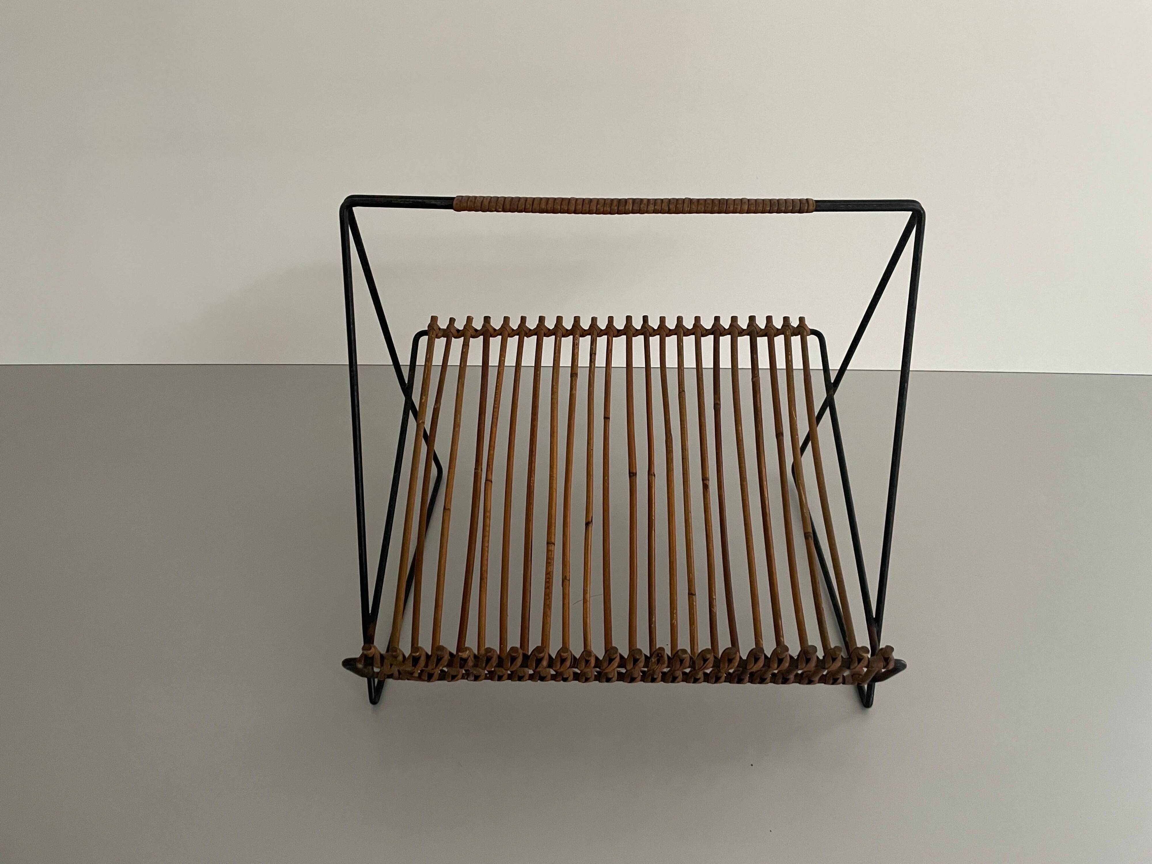 Mid-century black metal and rattan magazine rack, 1960, Italy