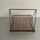 Mid-century black metal and rattan magazine rack, 1960, Italy