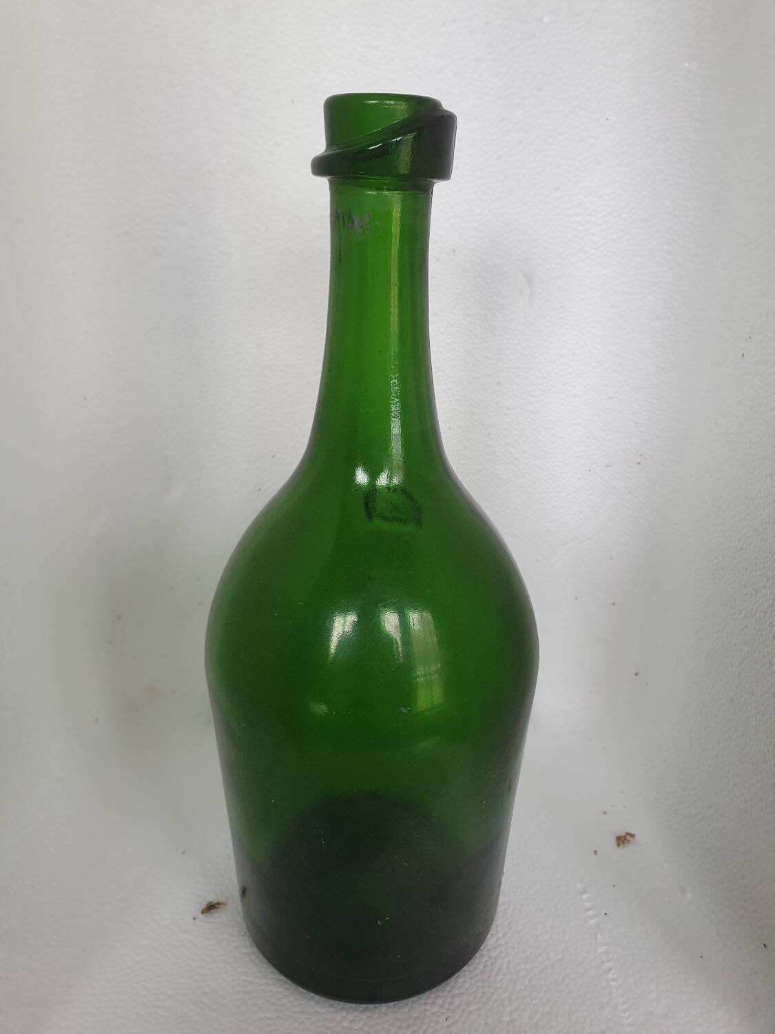 Old thick green glass bottle