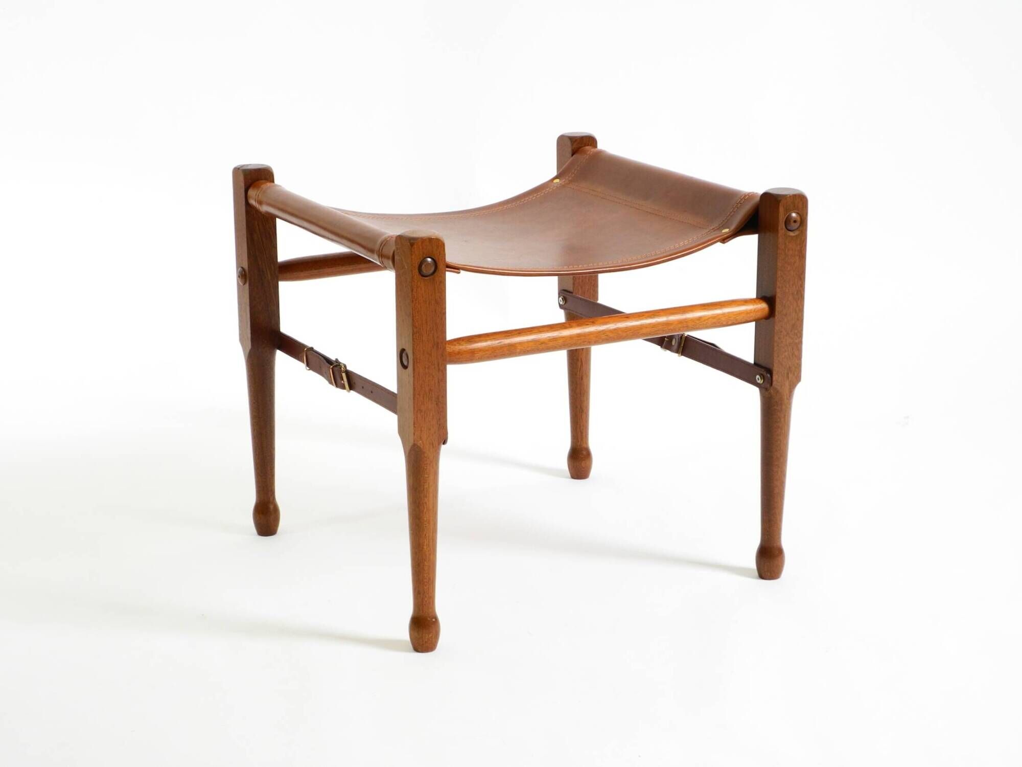 Rare 1990s safari stool with a teak frame and a seat made of brown saddle l