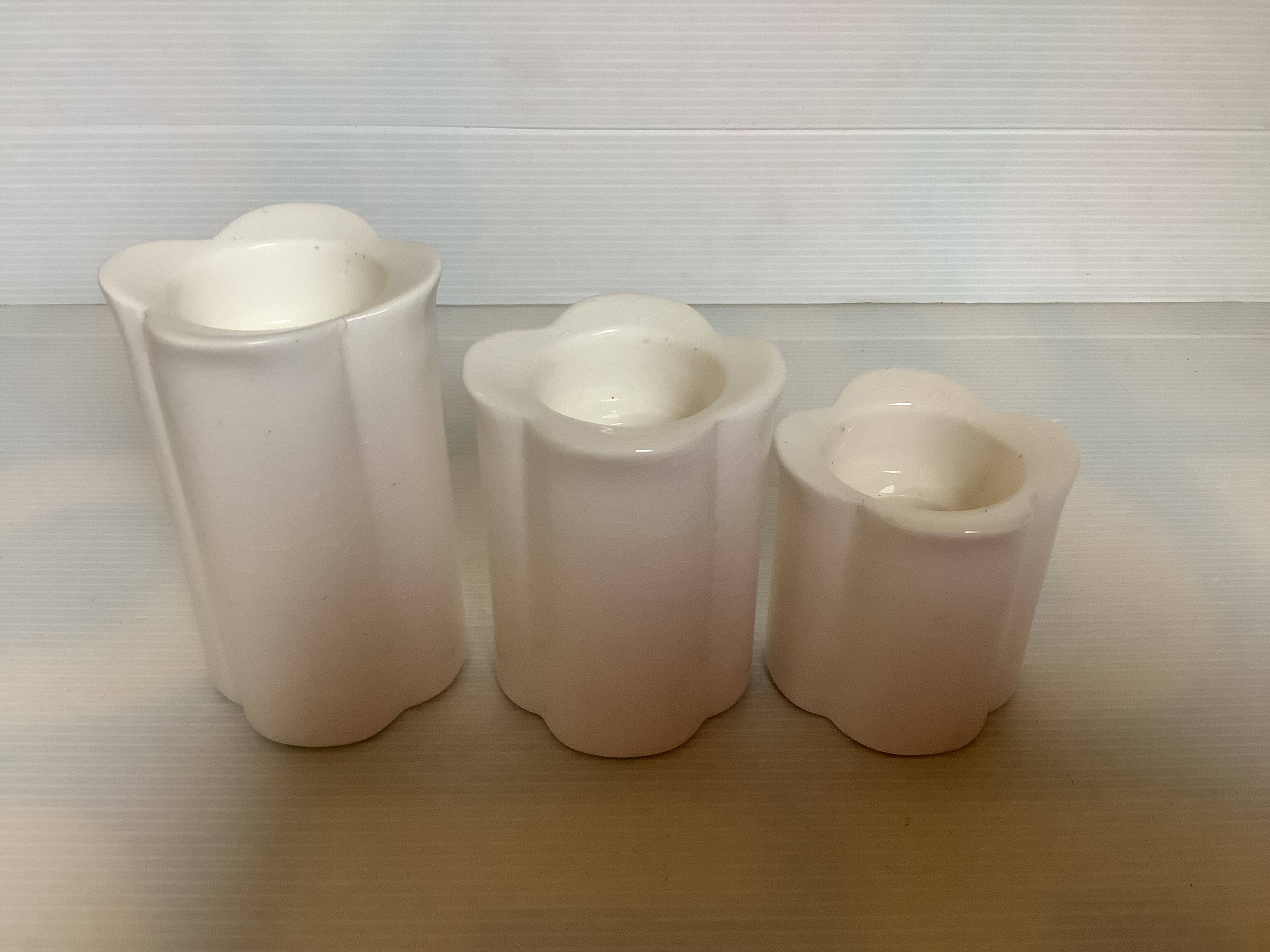 Trio of four-leaf clover candle holders